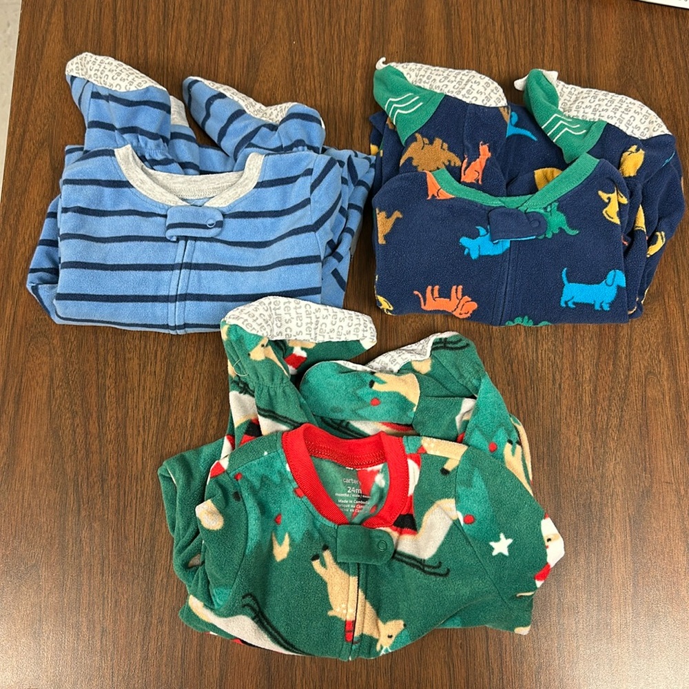 Bundle of Carter’s footie, fleece pajamas 24 months